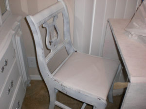 Here's the chair before we repainted and recovered it.