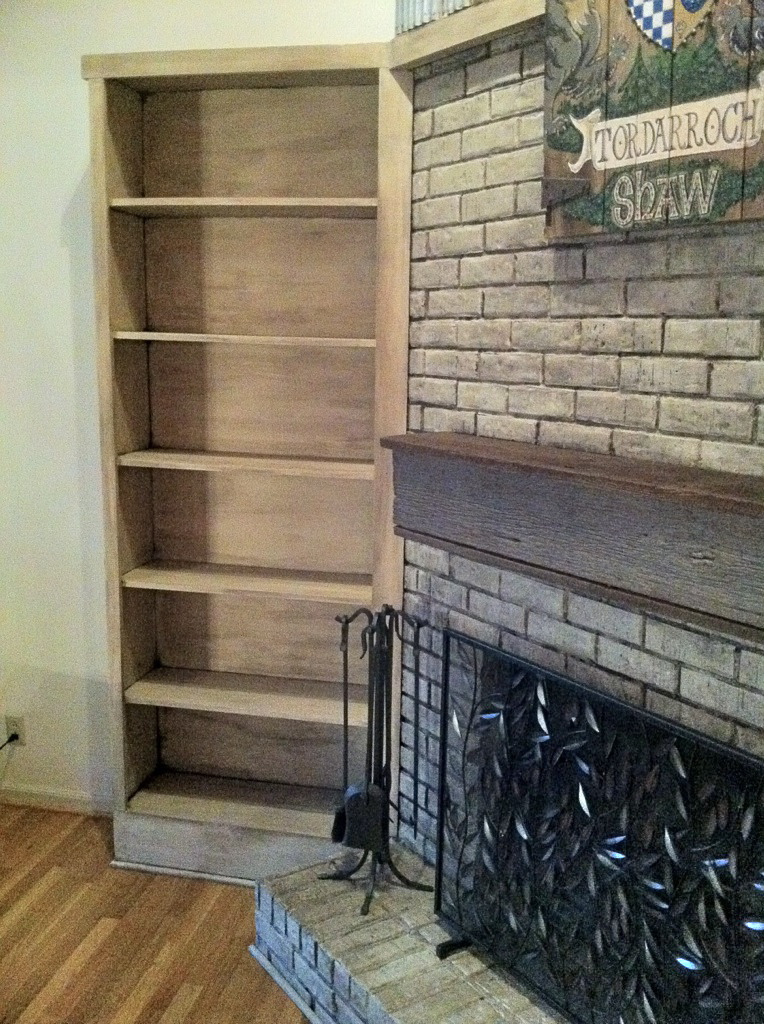 Fireplace with painted and waxed bookcases