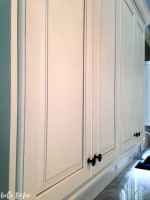 White painted cabinets with a chocolate glaze.