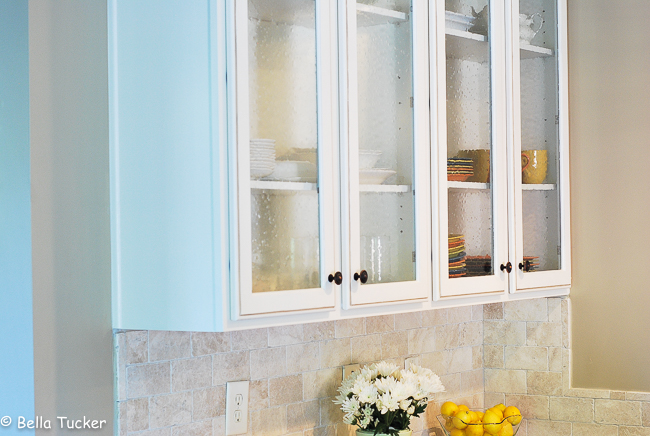 two glass cabinet doors were added in this kitchen makeover